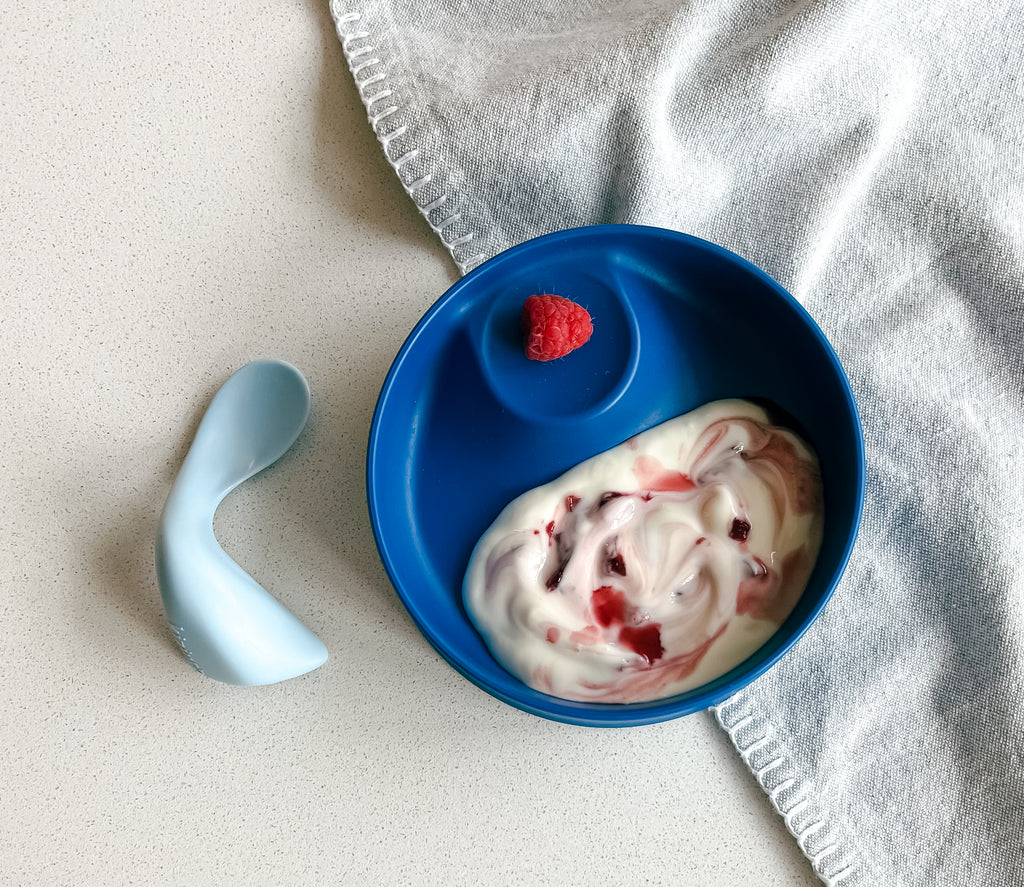 blue bowl with yogurt and cherry compote