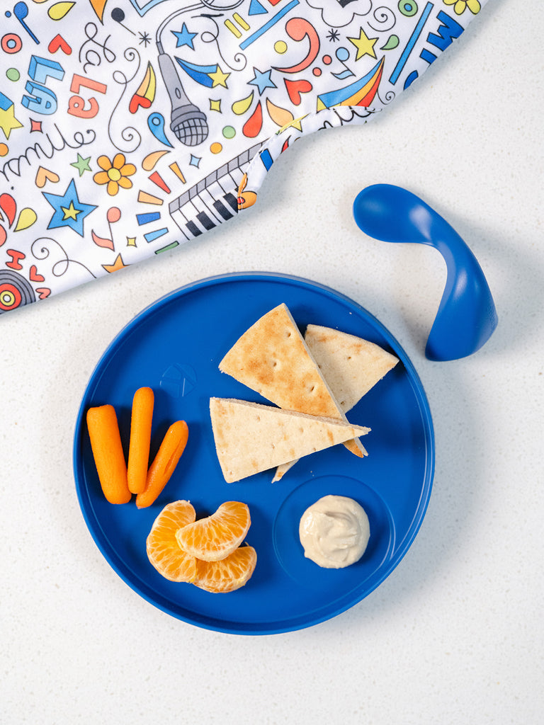 blue plate with pita bread snack, spoon, and bib