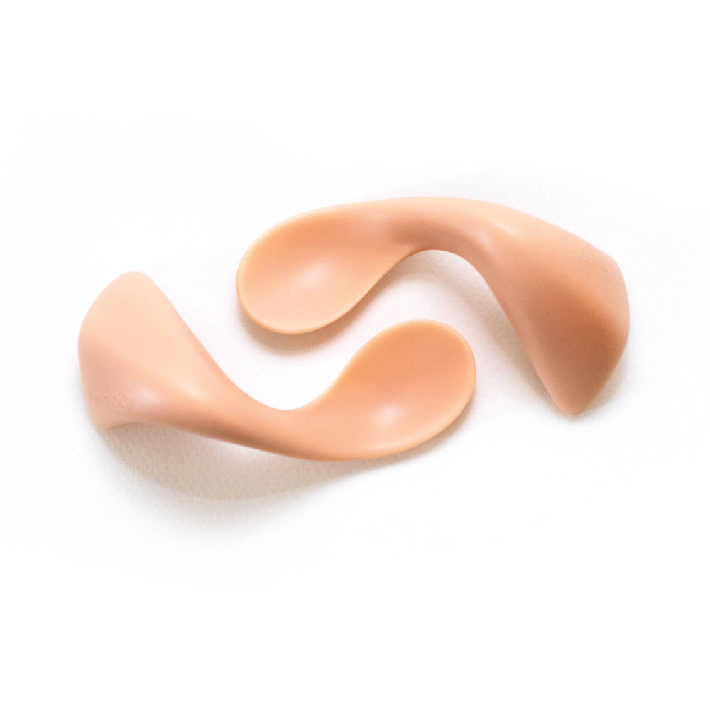 two peach curved toddler spoons